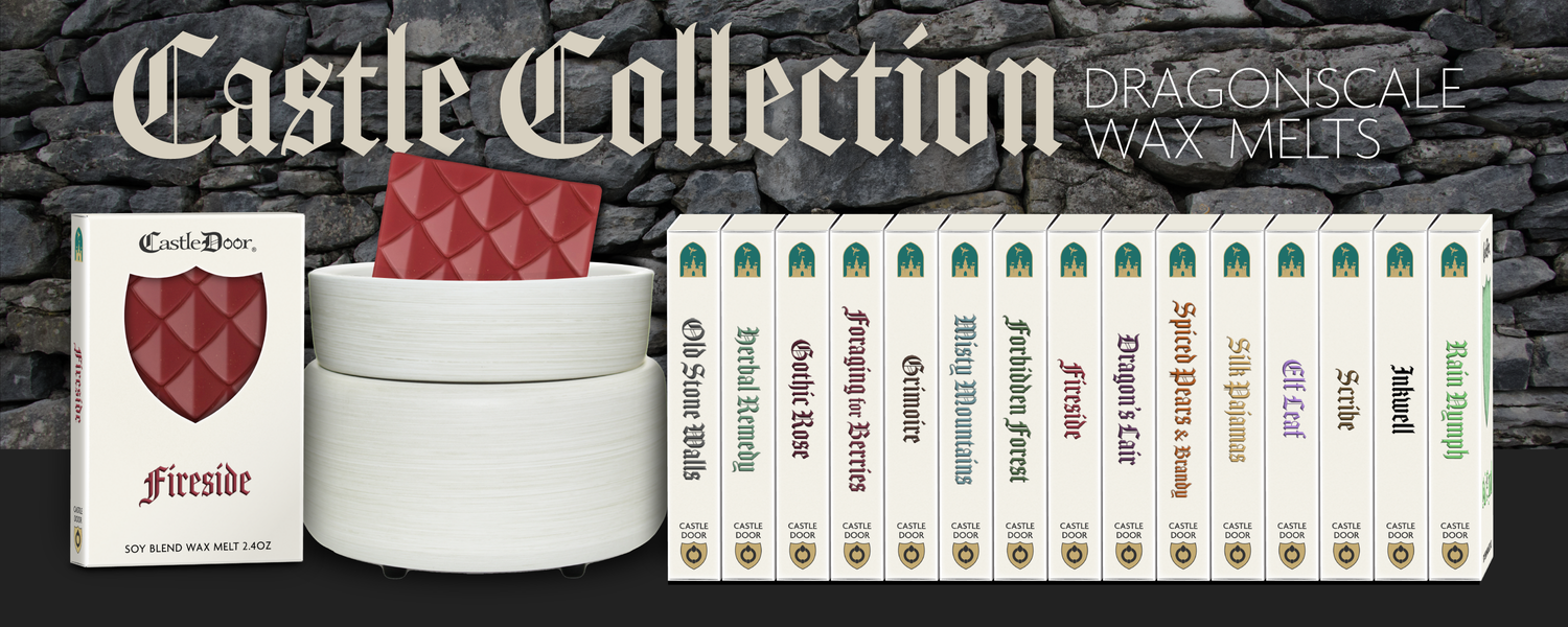 Castle Collection dragonscale wax melts displayed with electric wax warmer and boxed scents
