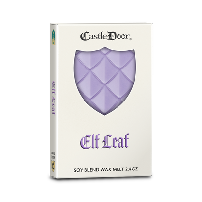 Castle Door Elf Leaf dragonscale wax melt in white book-style packaging, with lavender-purple dragonscale wax visible through a shield-shaped window.