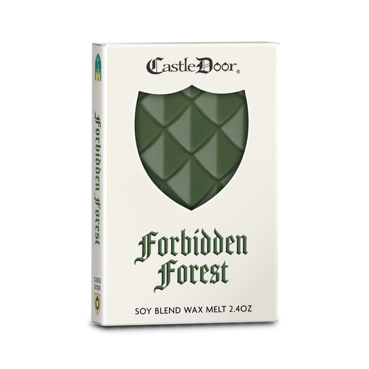 Castle Door Forbidden Forest dragonscale wax melt in white book-style packaging, with green dragonscale wax visible through a shield-shaped window.