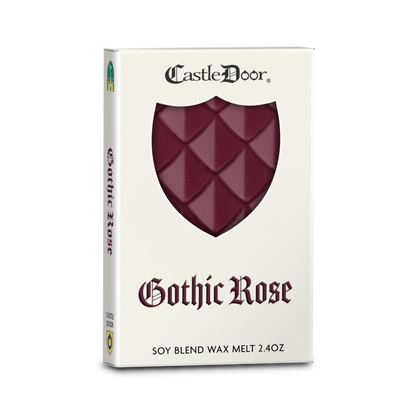 Castle Door Gothic Rose dragonscale wax melt in white book-style packaging, with burgundy dragonscale wax visible through a shield-shaped window.