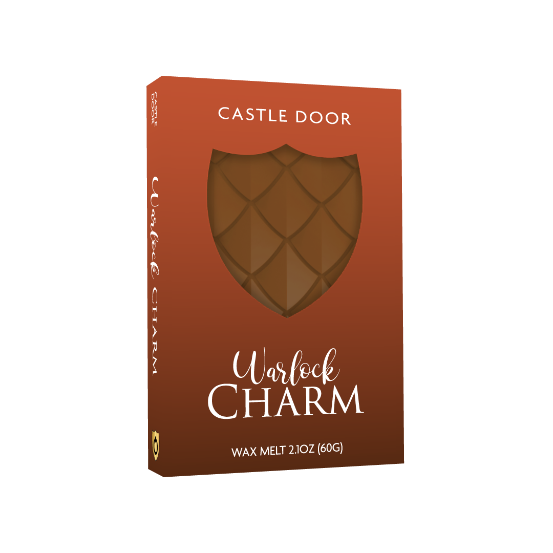 Warlock Charm dragonscale wax melt in orange Cozy Witch packaging with shield window