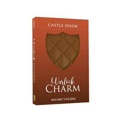 Warlock Charm dragonscale wax melt in orange Cozy Witch packaging with shield window