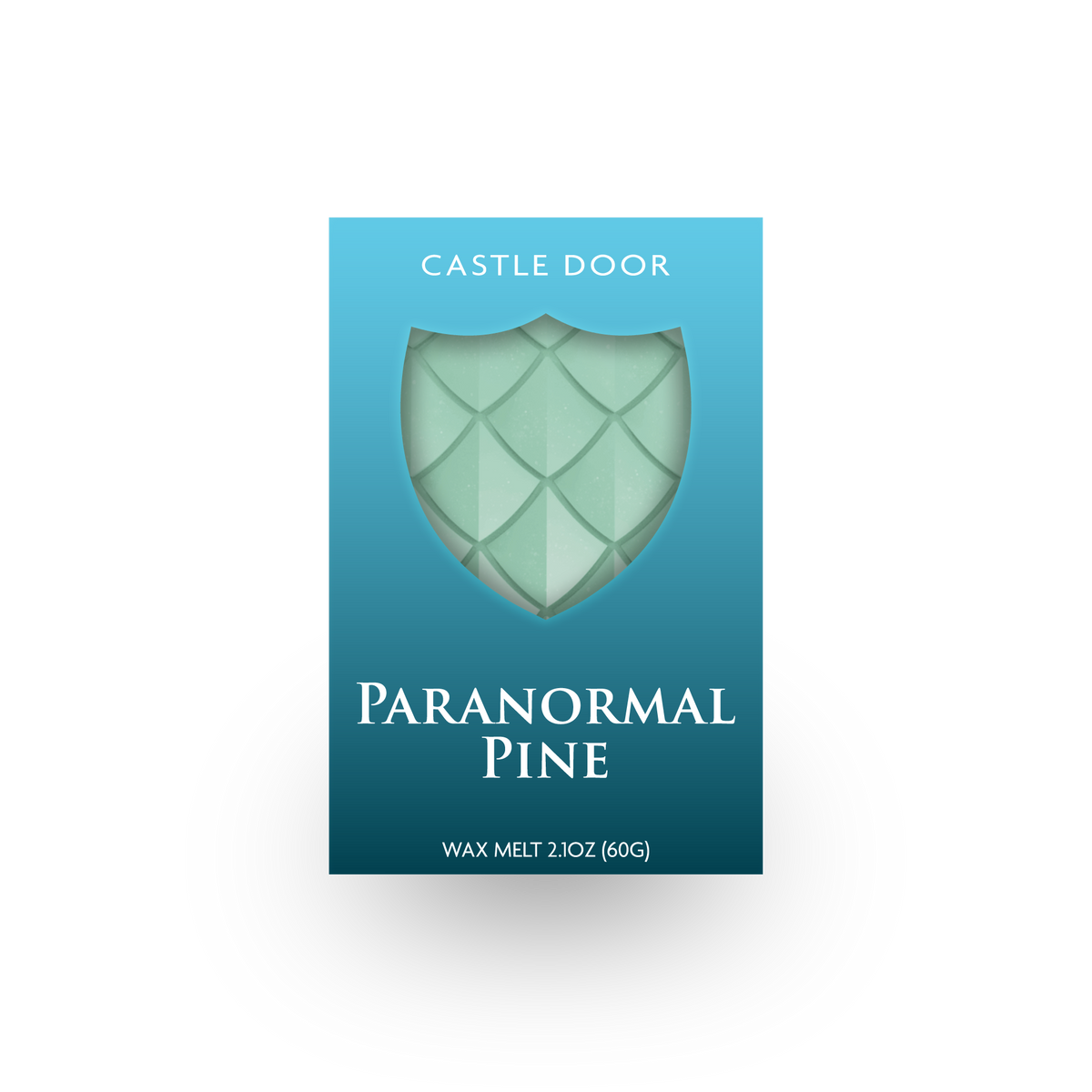 Front packaging of Castle Door Paranormal Pine wax melt, featuring pale green dragonscale wax visible through a shield-shaped window.