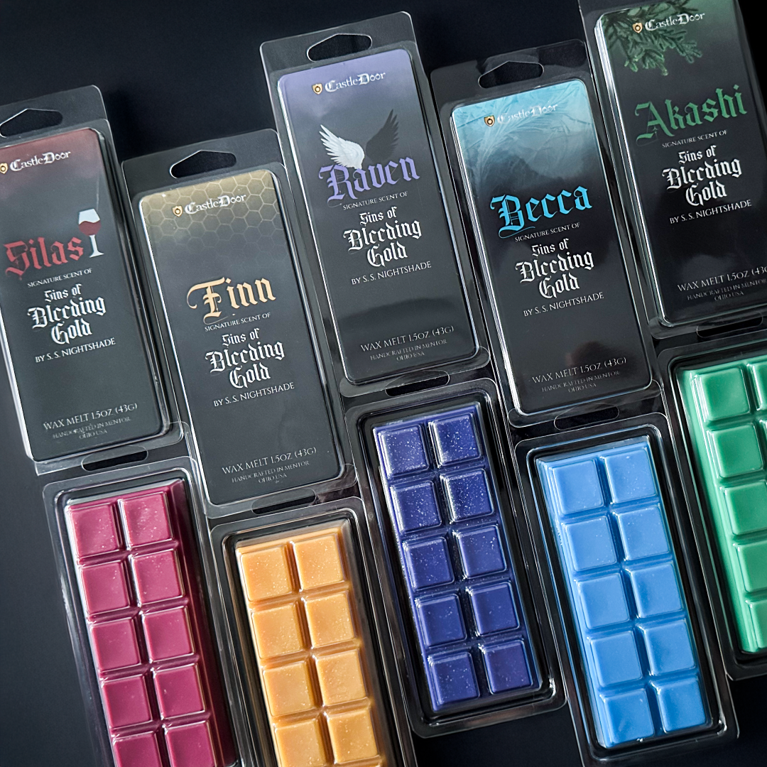 Five character-inspired Sins of Bleeding Gold wax melts: Raven, Akashi, Becca, Finn, and Silas